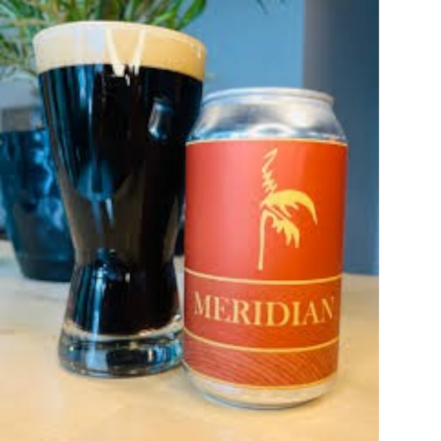Stowe Public House & Bottle Shop Meridian Porter beer can next to a glass of dark porter with a thick tan head.