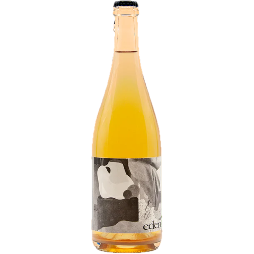 Stowe Public House & Bottle Shop Eden Ciders Benjamin Petillant Naturel cider, bright yellow, in a clear glass bottle with a black cap.