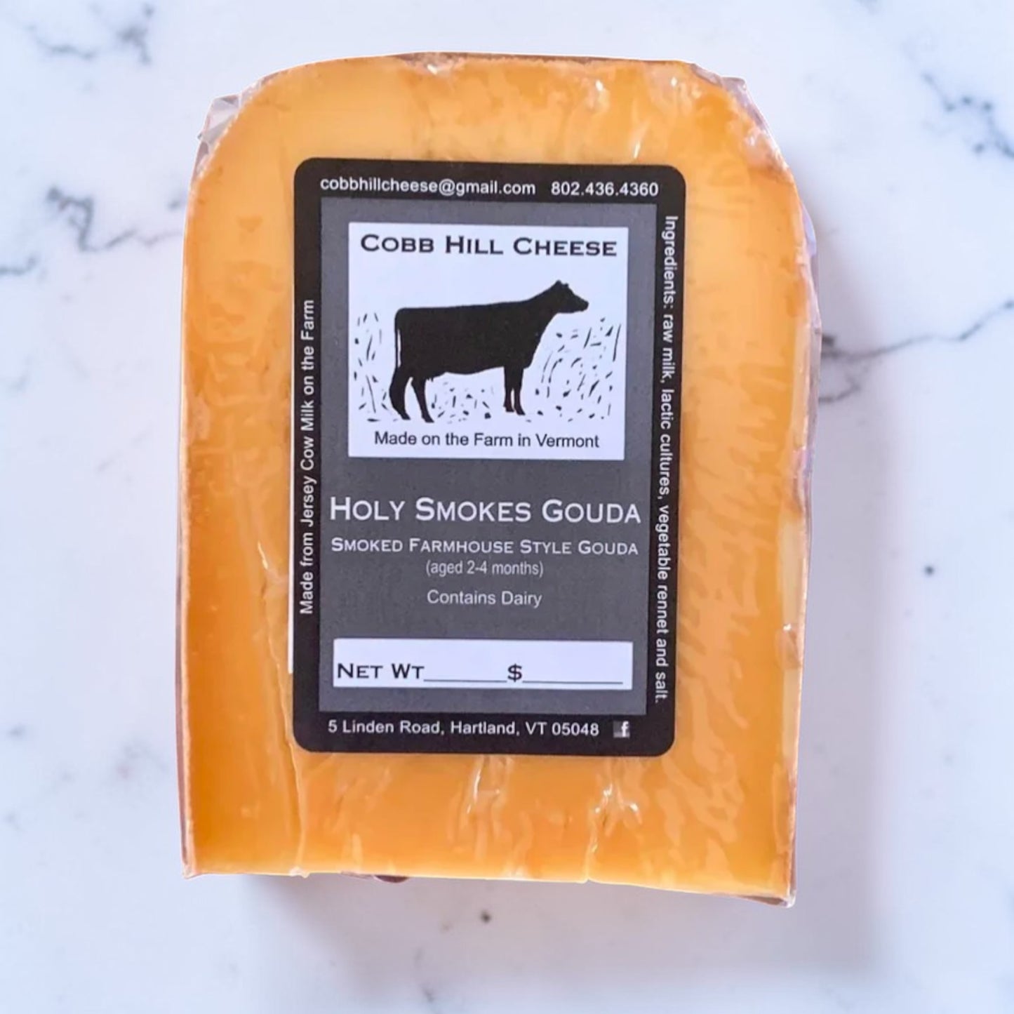 Stowe Public House & Bottle Shop's Holy Smokes Gouda, a Dutch-style cheese aged 2-4 months and smoked. Made with raw milk.