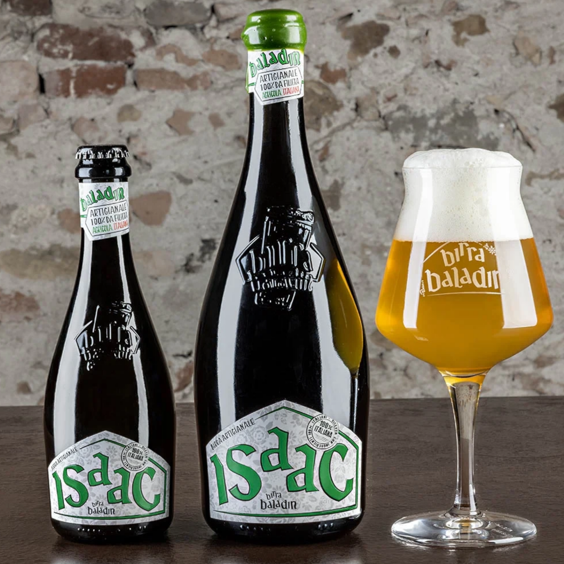 Stowe Public House & Bottle Shop Baladin Isaac witbier bottles and a glass of golden wheat beer on a wooden table.