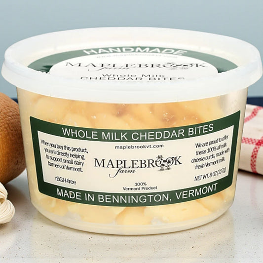 Maplebrook Farm Whole Milk Cheddar Bites, 8oz container of fresh, squeaky cheese curds made in Vermont.