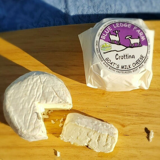 Stowe Public House & Bottle Shop Crottina goat cheese with white mold exterior and velvety smooth interior.