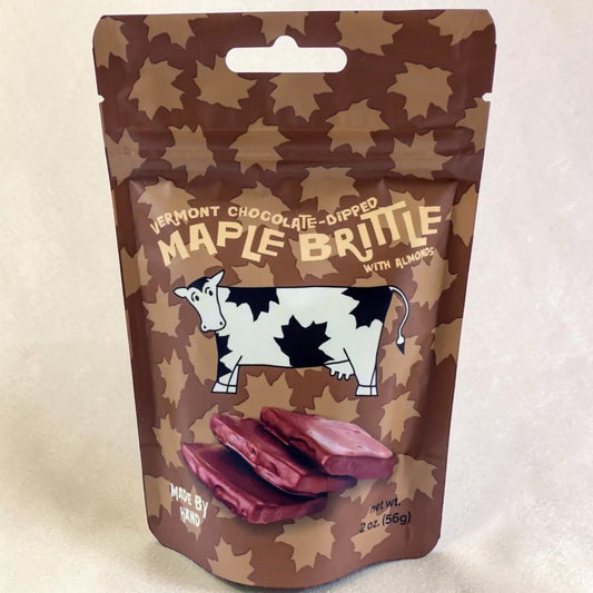 Stowe Public House & Bottle Shop Vermont Chocolate-Dipped Maple Brittle with almonds in a resealable pouch featuring a cow illustration and maple leaf pattern.