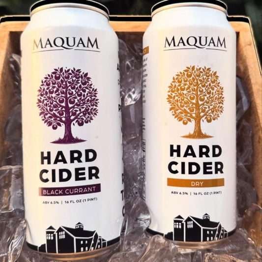 Stowe Public House & Bottle Shop Maquam Dry Cider cans, one black currant and one dry, featuring apple tree graphics.