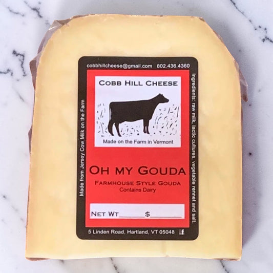 Stowe Public House & Bottle Shop Oh My Gouda farmhouse style cheese, aged 2-4 months, made with raw milk from Jersey and Holstein cows.