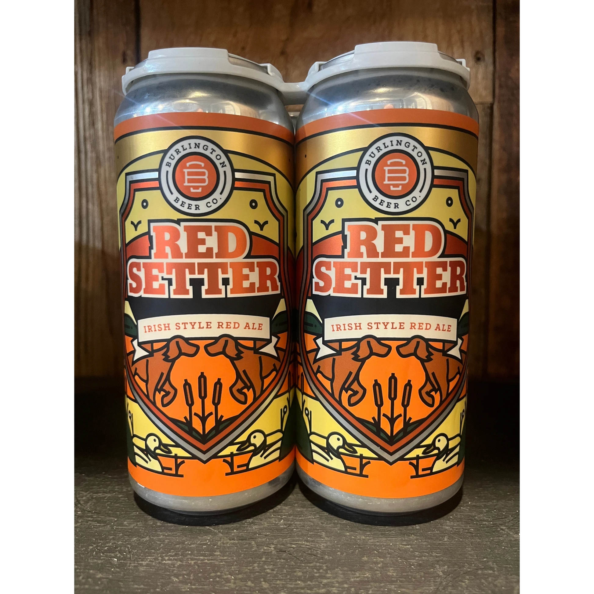 Stowe Public House & Bottle Shop: Burlington Beer Co. Red Setter Irish Style Red Ale cans. Features red setters and ducks.