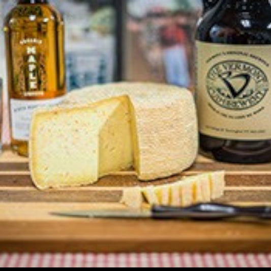 Stowe Public House & Bottle Shop Tres Amigos artisan cave-aged cheese with sundried tomatoes, garlic, and onions. Aged 4 months.