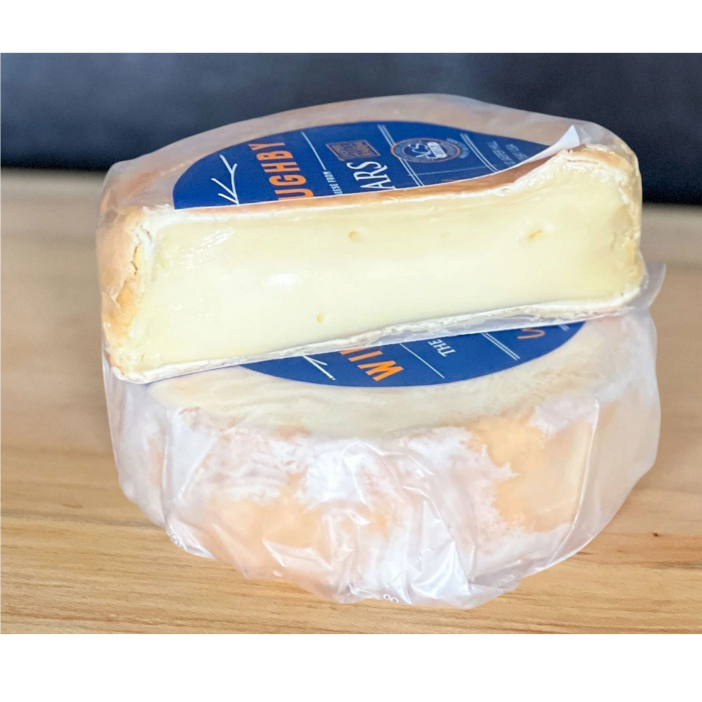 Stowe Public House & Bottle Shop Jasper Hill Willoughby washed-rind cheese, creamy yellow interior, pale rind, subtle milky and herbal notes.