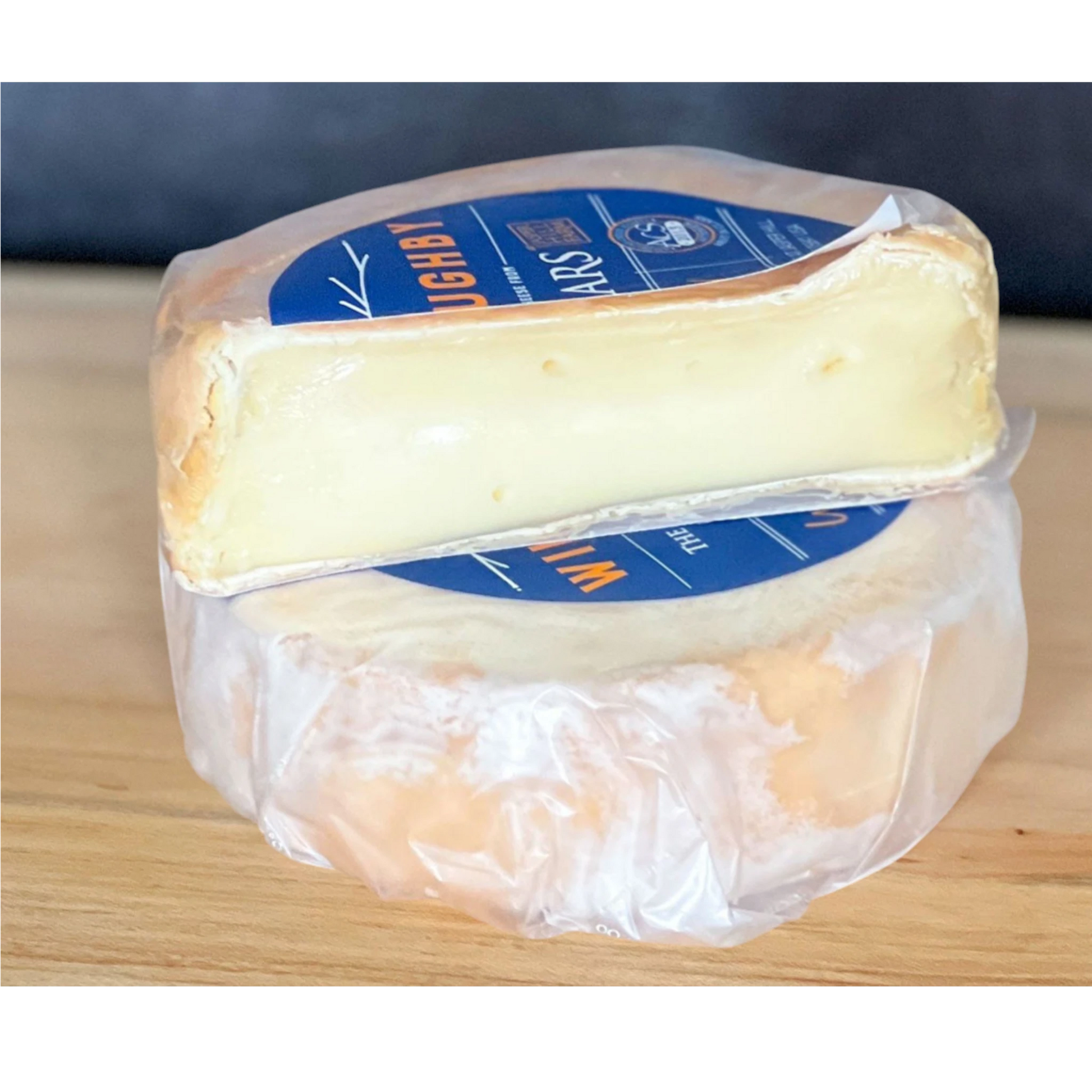 Stowe Public House & Bottle Shop Jasper Hill Willoughby washed-rind cheese, creamy yellow interior, pale rind, subtle milky and herbal notes.