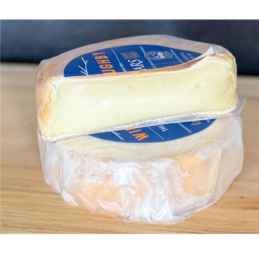 Stowe Public House & Bottle Shop Jasper Hill Willoughby washed-rind cheese, creamy yellow interior, pale rind, subtle milky and herbal notes.