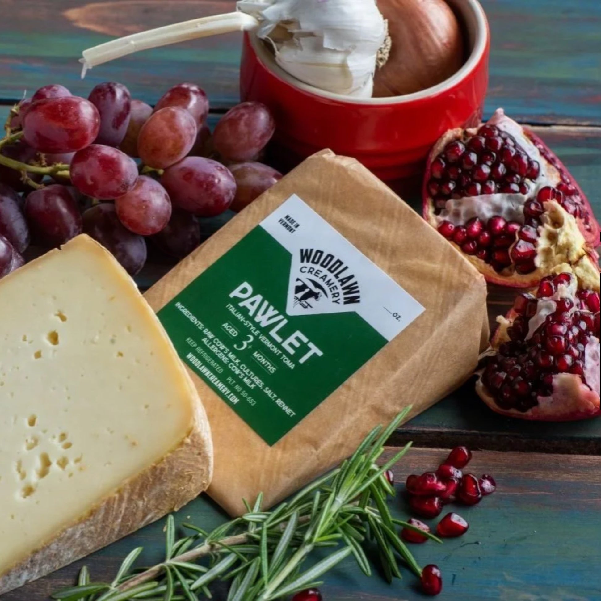 Stowe Public House & Bottle Shop Woodlawn Creamery Pawlet Italian-style toma cheese, aged 3 months, with grapes and pomegranate.