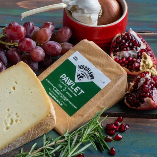 Stowe Public House & Bottle Shop Woodlawn Creamery Pawlet Italian-style toma cheese, aged 3 months, with grapes and pomegranate.